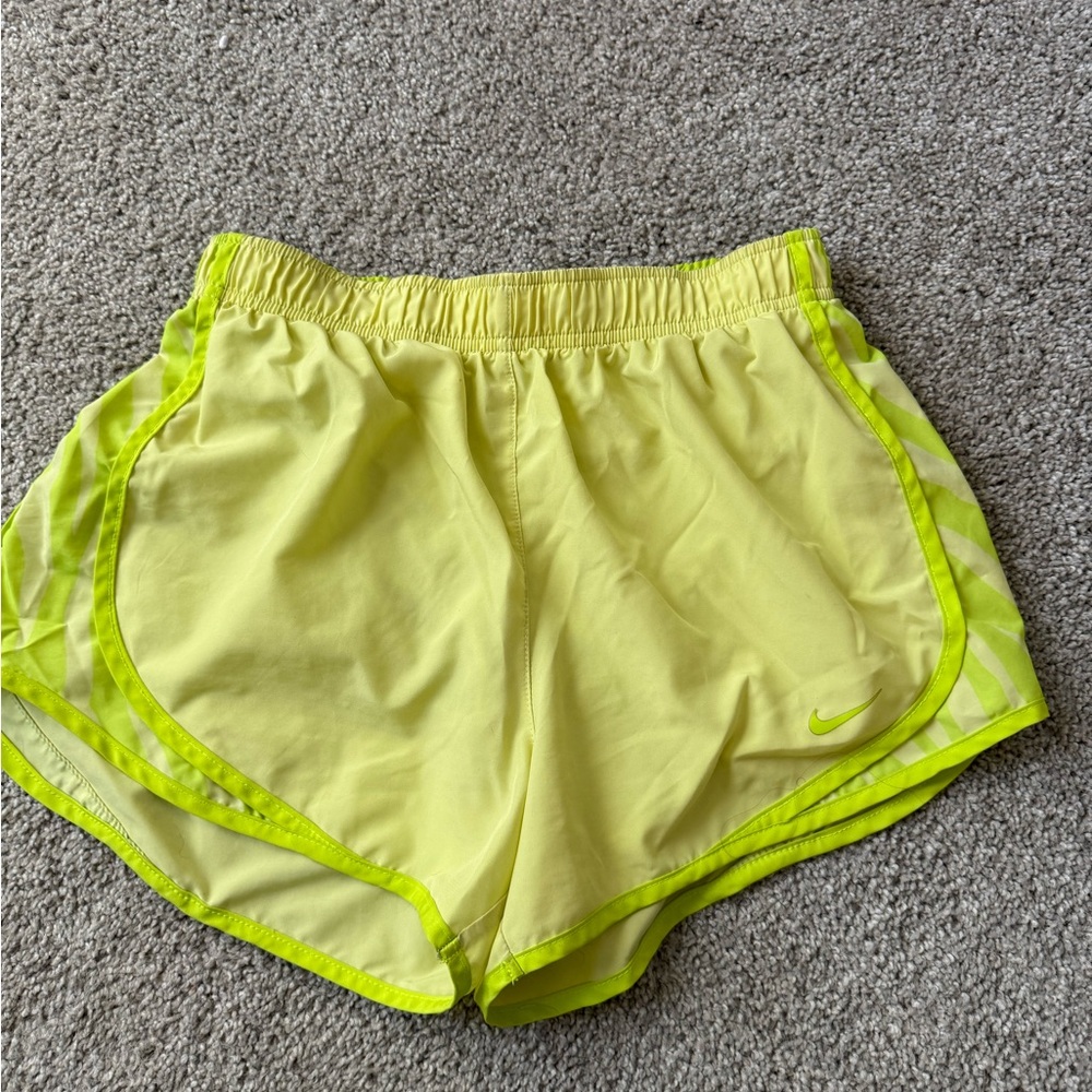 Yellow Nike running shorts